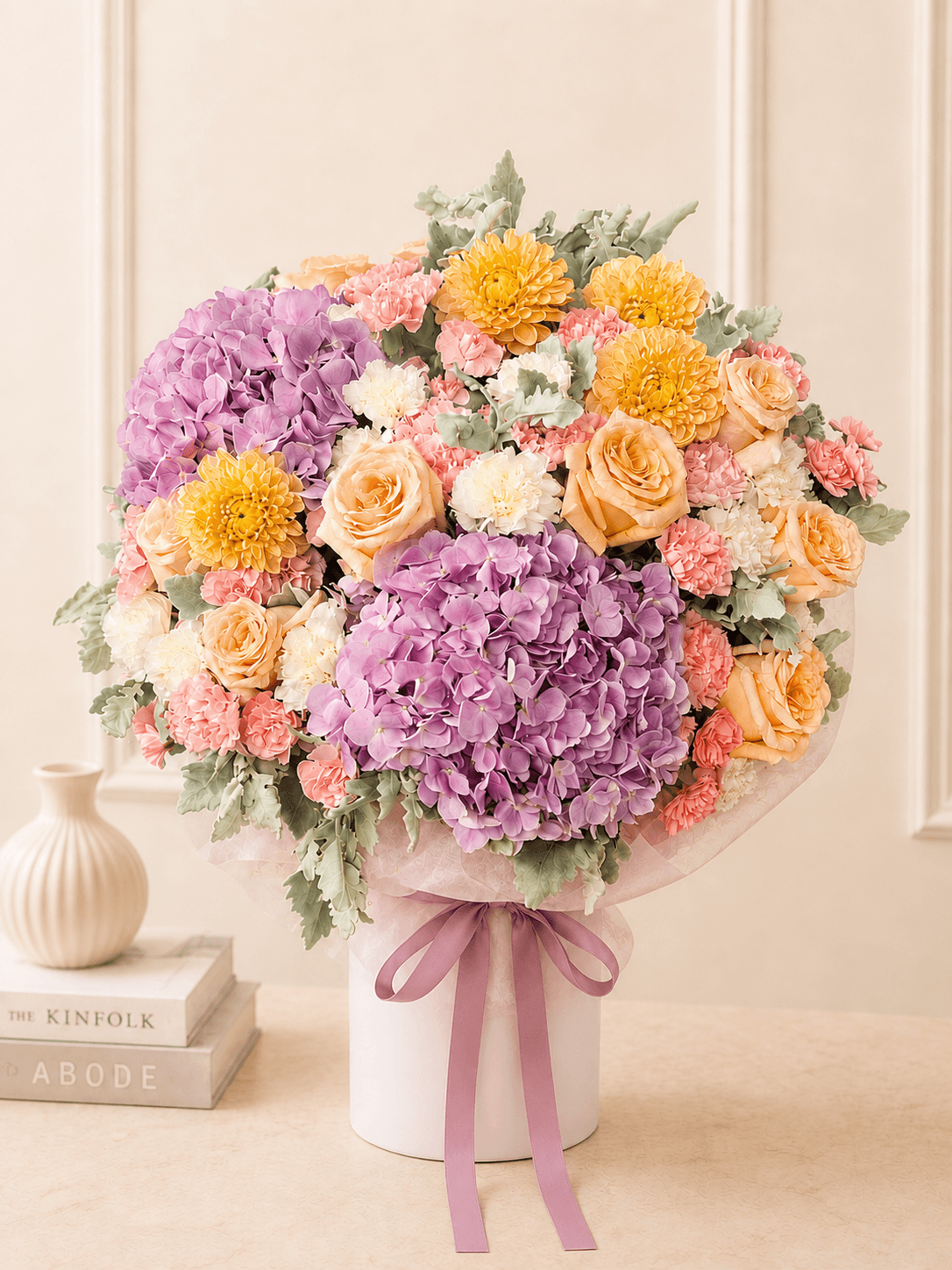 A generous Custom Blume in lilac, apricot, yellow and soft pink, finished with a plain mauve ribbon