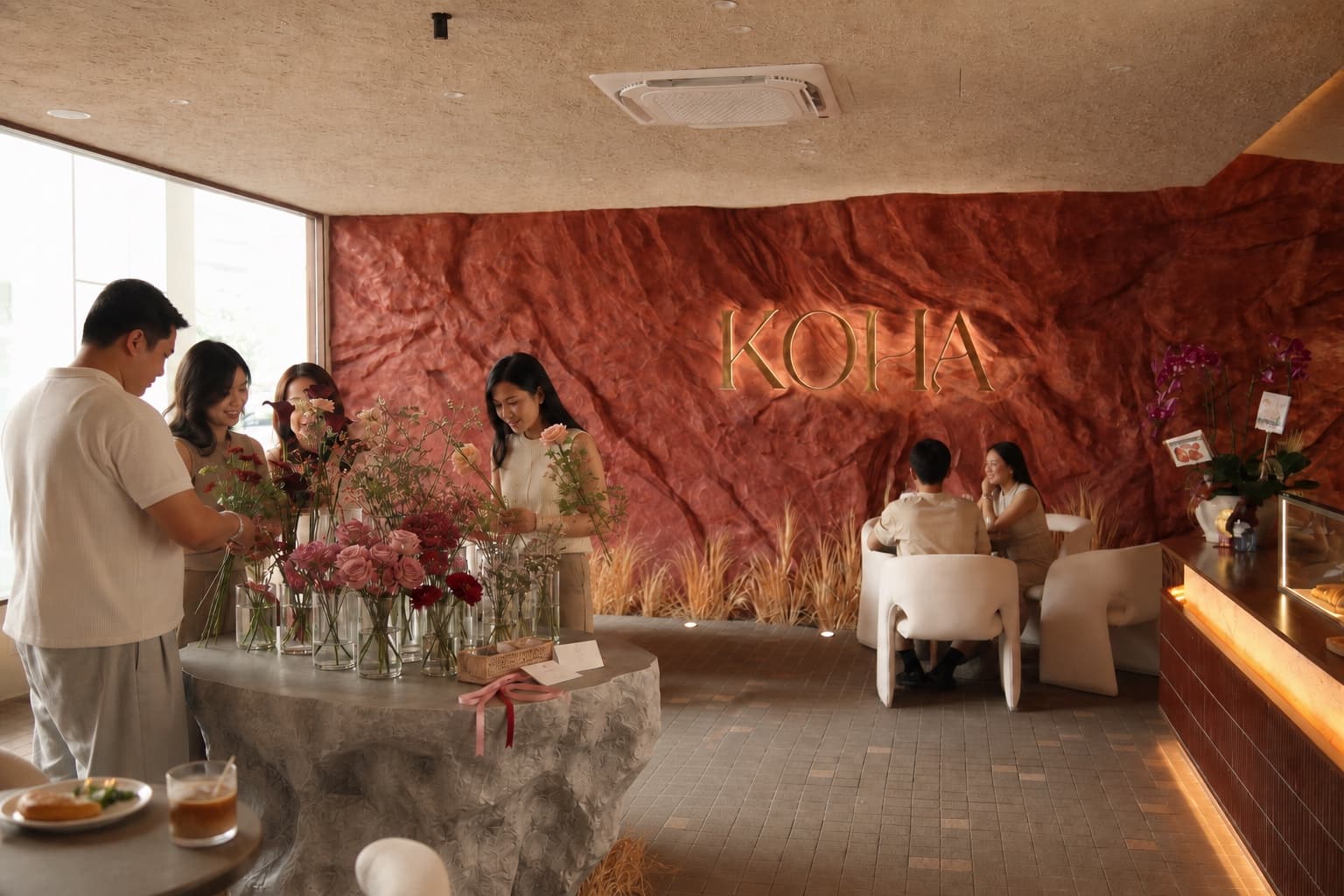 Guests choosing flowers together at the Blume Bar inside KOHA Bistro.