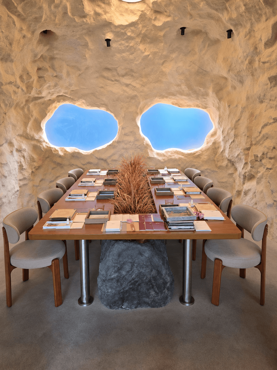 A long table prepared with flower presses, wooden frames and materials for a private Pressed Blume Workshop.
